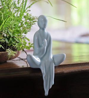 Meditating lady in white ceramic home decor