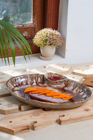 Oval ceramic serving tray with dip