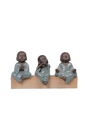 Set of three monks: Playing flute, praying & meditating