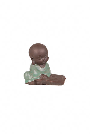 Sitting monk with book décor