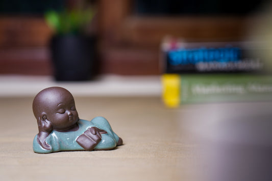 Lying monk Holding Book Decor