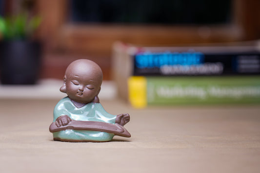 Sitting Monk With Book Décor