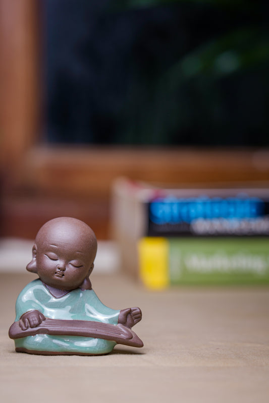Sitting Monk With Book Décor