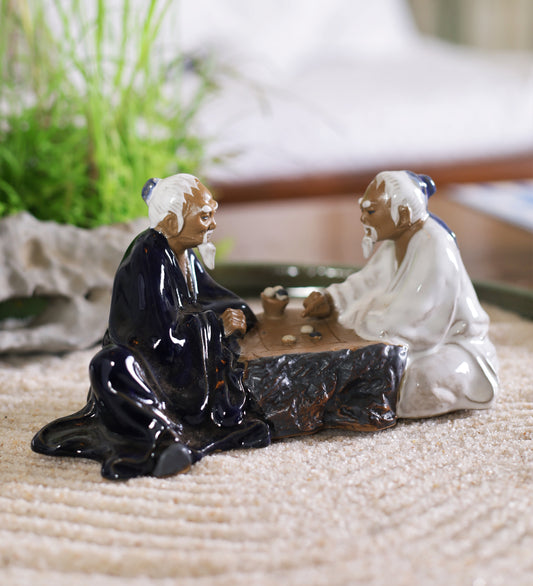 Men Playing Board Game Ceramic Miniature