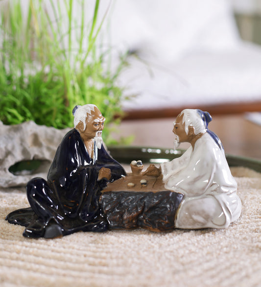 Men Playing Board Game Ceramic Miniature