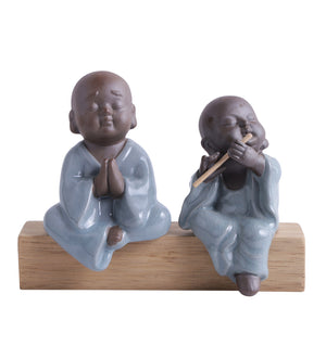 Pair of monk praying and playing flute