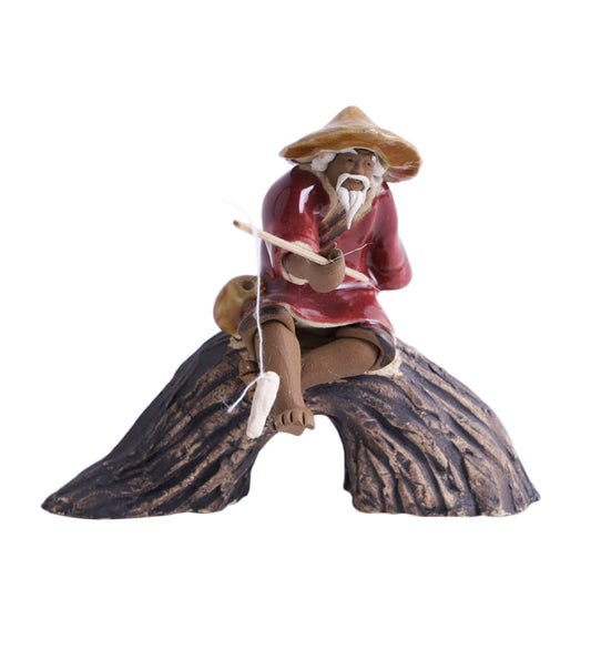Old Fisherman Sitting On U Rock With Fishing Rod